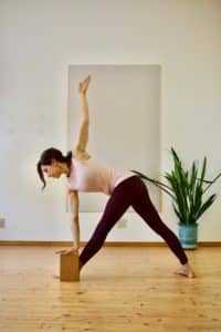 Fertility yoga pose revolved triangle
